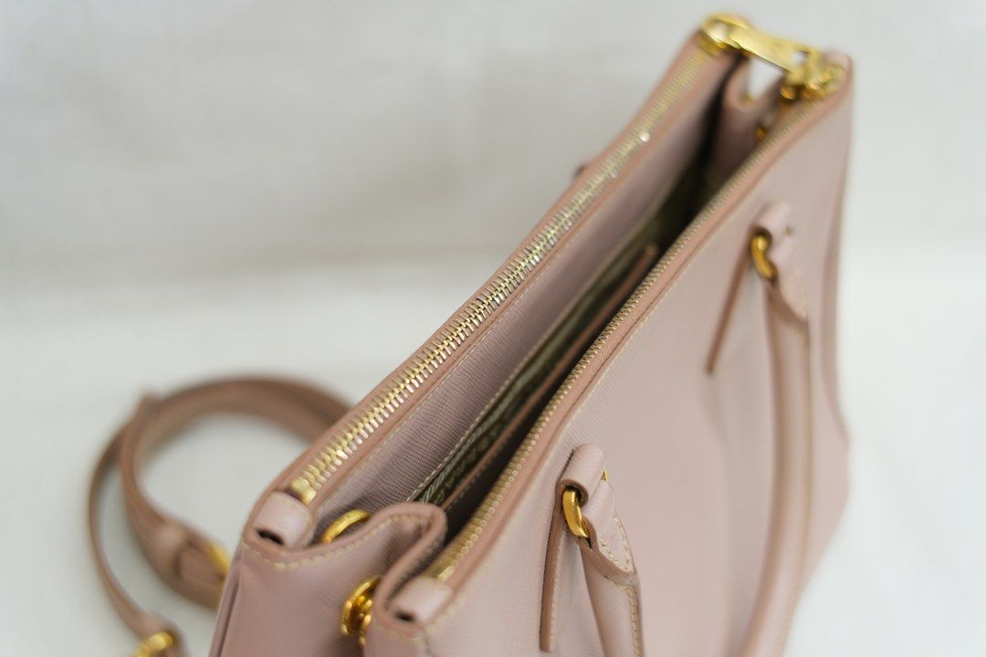 PRADA DOUBLE ZIP (Category: Luxury Bags & Wallets) located in Quezon City. Submitted by mcikgm (Listing ID 1409222868, Image 3). Description: - PRADA Double Zip Galleria Saffiano Leather bag - With Authenticity Cert - Blush pink color - Crossbody style with detachable strap - Features gold hardware.