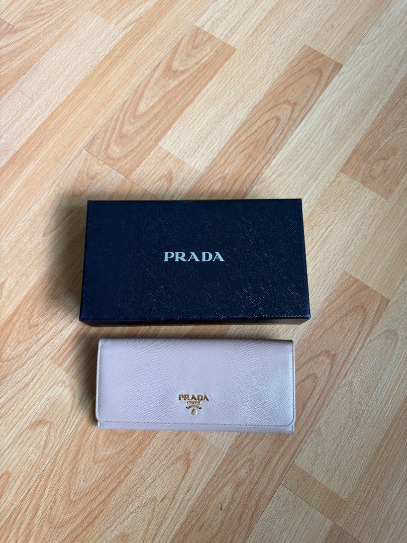 Prada saffiano long wallet leather pink beige (Category: Luxury Bags & Wallets) located in Quezon City. Submitted by declutterwithmeee02 (Listing ID 1409238355, Image 1). Description: Prada saffiano long wallet leather pink beige Brand new With box and dustbag SRP: 55k+.