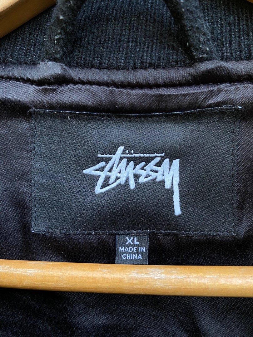 Stussy Comme des Garcons CDG Varsity Jacket XL (Category: Coats, Jackets and Outerwear) located in Bayambang. Submitted by vintagestuffph (Listing ID 1409191177, Image 3). Description: - Stussy Varsity Jacket - Size: XL - Features: - Embroidered patches (front & back) - City names & CDG logo - Made in China - Black with white striped ribbed collar, cuffs, and hem - Black lining.