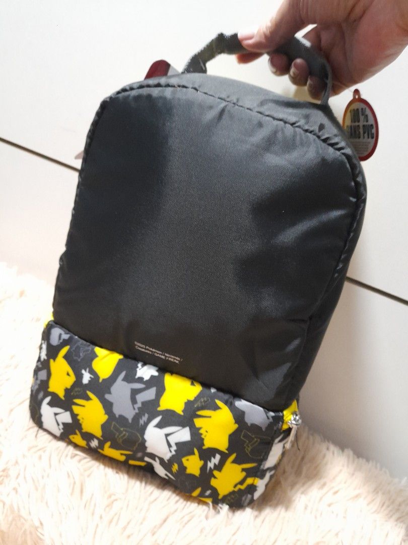 Thermos Pokemon Insulated Lunch Box (Category: Food Organization & Storage) located in Pateros City. Submitted by armcandystuff (Listing ID 1409184242, Image 3). Description: - Pikachu Thermos lunch box - Black with yellow accents - Zippered closure - Convenient handle - Keeps food fresh - Includes tag.
