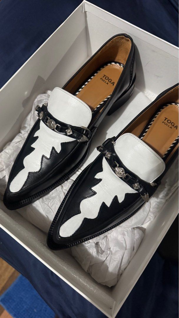 Toga Pulla Black and White Loafers (Category: Loafers) located in Quezon City. Submitted by cieloooo (Listing ID 1409115375, Image 3). Description: Toga Pulla Loafers Size 39 With heel protector Original Price: Php 30k Shipping shouldered by buyer.