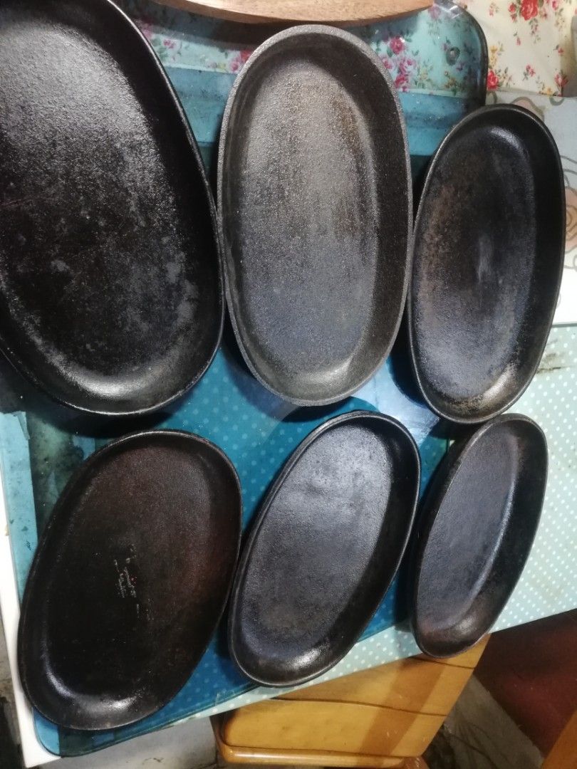 6pcs cast iron sizzling plates, bundle (Category: Other Kitchenware & Tableware) located in Paranaque City. Submitted by 4thestate.surplusan (Listing ID 1409283344, Image 1). Description: 6pcs plates, 1pc wooden base plus 4pcs handle. rust and dirt, maintenable..