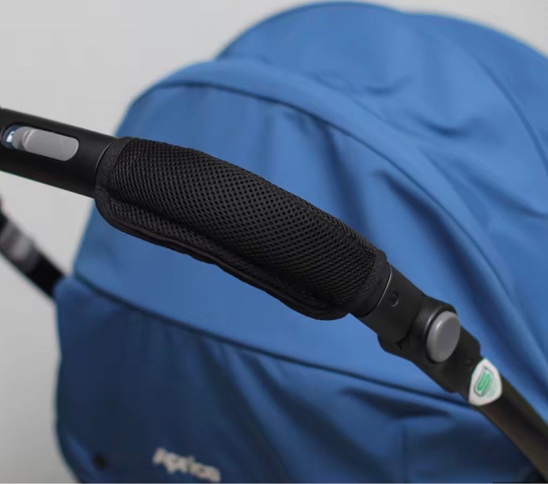 Aprica Stroller Handle Cover (Category: Strollers) located in Makati City. Submitted by riz.gspr (Listing ID 1409414285, Image 2). Description: - Universal fit for all stroller models - Made with breathable 3D soft mesh - Features the Aprica brand logo - Color: Black - Designed for stroller handles and bars.