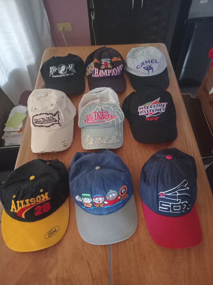Assorted Caps (Vintage, Y2K, Modern) (Category: Caps & Hats) located in Dumaguete. Submitted by neeks.vtg (Listing ID 1409388325, Image 1). Description: Collection of assorted caps featuring various designs and brands. Includes caps with "Von Dutch", "Camel", "Allison 28", and "South Park" characters. Different colors and styles are available. Perfect for adding a touch of personality to your outfit..