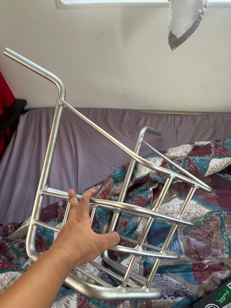 Bike Basket (Category: Bicycles) located in Manila. Submitted by lutherfrank (Listing ID 1409377654, Image 2). Description: Bike basket for front attachment. Rectangular shape with grid design. Features two curved handles. Silver color. From Puma Piko Bike .