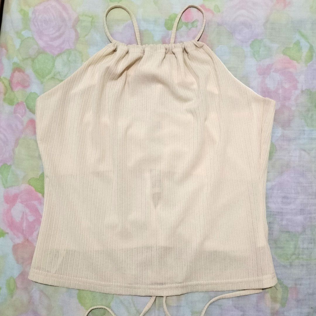 Cream Beige Beach Spaghetti Straps Top (Category: Sleeveless) located in San Fernando. Submitted by decluttrwithella (Listing ID 1409333497, Image 1). Description: Size: XS-S, measurements are shown in the photos (please allow 1-2 cm difference)📸 Color: Cream/Beige (colors shown in photos may vary slightly due to lighting and different screens) Condition: Thrifted, super cute, no flaws!👌 PLS READ👇 - Payments thru Gcash - Shipping thru J&T - No