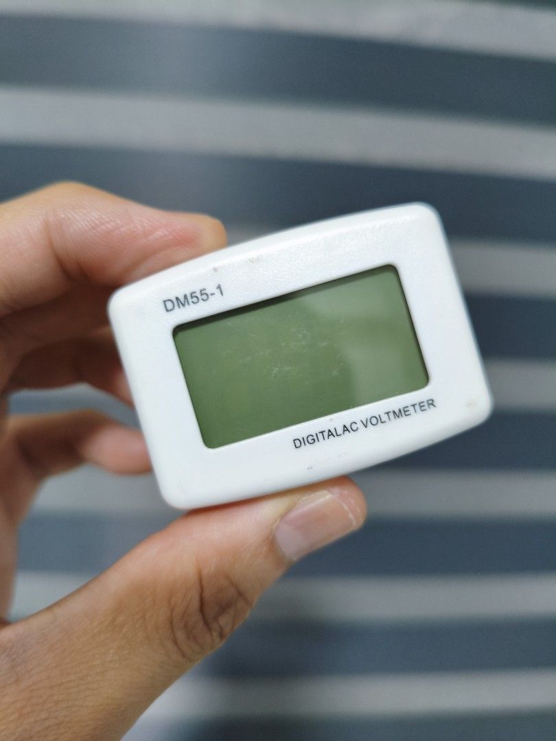 Digitalac DM55-1 Voltmeter (Category: Electrical, Adaptors & Sockets) located in Pasig City. Submitted by garage.sale89 (Listing ID 1409380558, Image 1). Description: - Digitalac DM55-1 Voltmeter - Digital display - White casing - Two-prong plug - Compact size - Measures voltage - Model number clearly visible.