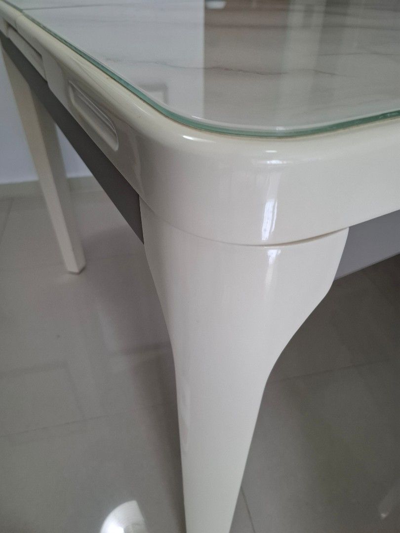 Extendable Dining Table (Category: Tables & Sets) located in Singapore. Submitted by illyakuryakin (Listing ID 1409304814, Image 1). Description: - Extendable dining table - Elegant marble-look surface - Modern white frame - Extends to fit more guests - Ideal for small or large gatherings - 80cm x 100cm - 80cm x 130cm when extended - self collect.