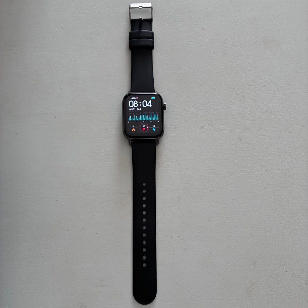 Gard Pro Health Smartwatch 2+ (HS2+) Black strap (Category: Wearables & Smart Watches) located in Taguig. Submitted by aaaaaaaaaay2k (Listing ID 1409289736, Image 1). Description: - Black smartwatch with a square display - Comes with an extra blue strap - Includes a charging cable with USB connector - Displays time and health metrics - Features a metal buckle and black body.