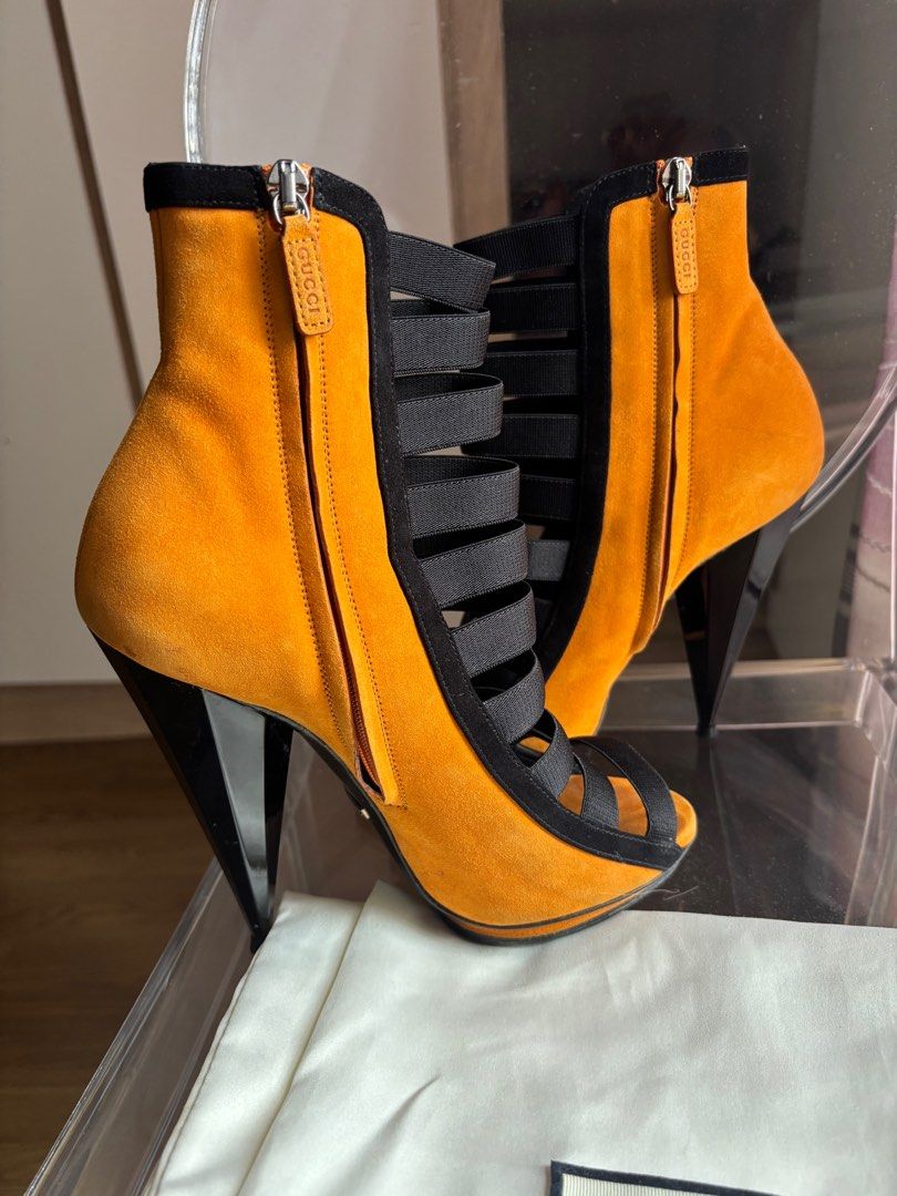 Gucci Open Toe Heels (Category: Sneakers & Footwear) located in Las Pinas. Submitted by itskat.cruz (Listing ID 1409394513, Image 3). Description: - Gucci open-toe heels - Vibrant orange suede upper - Black elastic straps - Side zipper - Unique heel design - Size 37 - Made in Italy - Comes complete (box, dustbag).