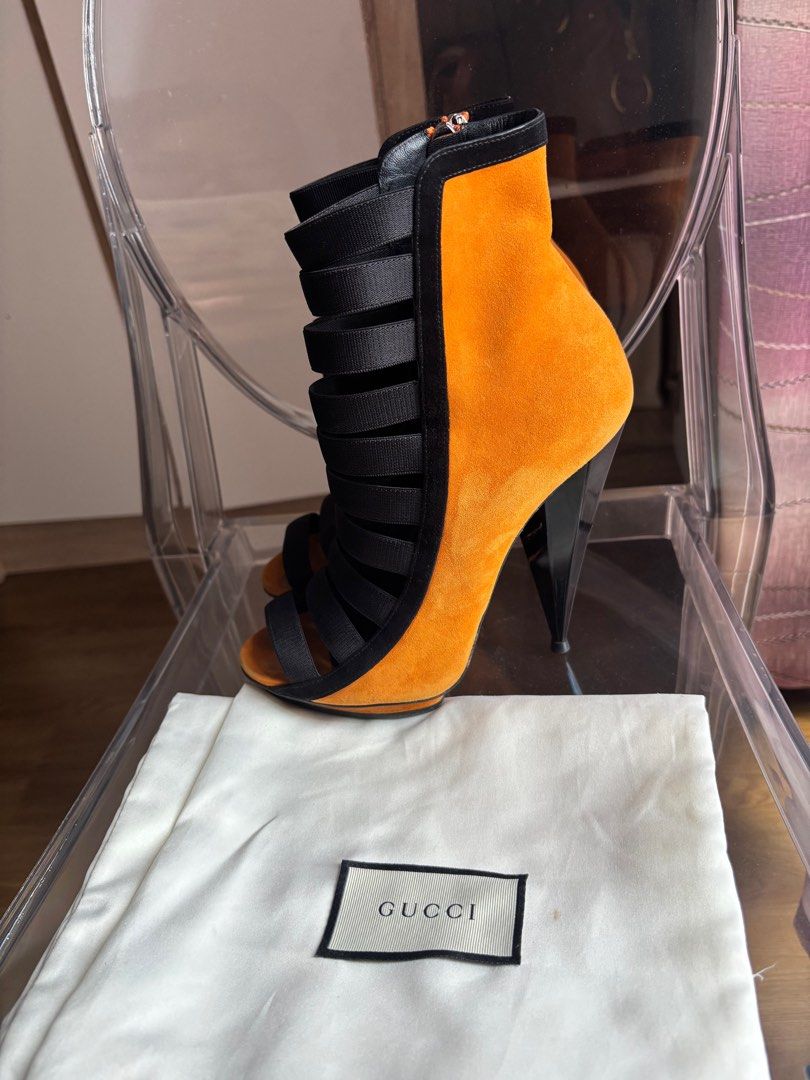 Gucci Open Toe Heels (Category: Sneakers & Footwear) located in Las Pinas. Submitted by itskat.cruz (Listing ID 1409394513, Image 2). Description: - Gucci open-toe heels - Vibrant orange suede upper - Black elastic straps - Side zipper - Unique heel design - Size 37 - Made in Italy - Comes complete (box, dustbag).