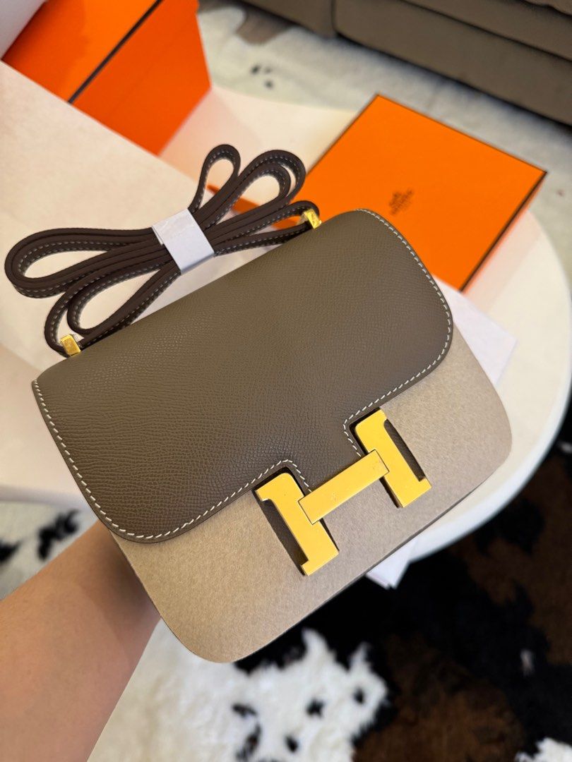 Hermes Mini Constance Bag (Category: Luxury Bags & Wallets) located in Manila. Submitted by beaumontandco (Listing ID 1409286818, Image 3). Description: - Hermes Mini Constance bag - Two-tone design: brown leather flap, beige suede body - Features gold-tone 'H' clasp - Includes matching shoulder strap - Leather-lined interior with slip pocket - Comes with original Hermes box.