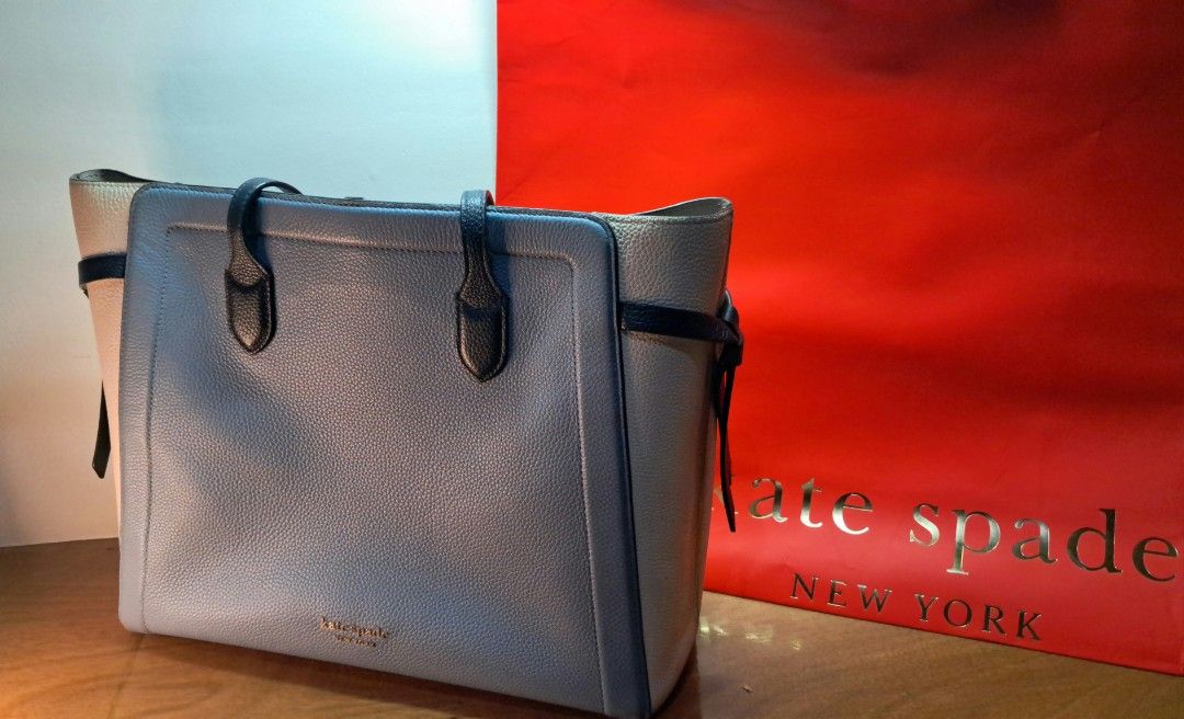 Kate Spade Knott Colorblocked Tote Bag (Category: Tote Bags) located in Manila. Submitted by cobydog (Listing ID 1409390553, Image 2). Description: DIMENSIONS 11.75"h x 14.5"w x 6"d Strap Drop: 11.5" FEATURES Hardware: Gold Tone Exterior material: Pebbled leather w/ smooth Italian trim Interior material: Fabric Style: Knott Colorblocked w/ leather strap & interior snap-tab slip pocket.