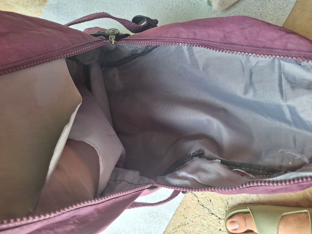 KIPLING Purple Small Backpack (Category: Backpacks) located in Malaybalay. Submitted by mags_sofia (Listing ID 1409379708, Image 3). Description: Dimensions: L: 14", W: 5:, H: 14.5" Material: - polyester exterior and interior - clothed and stitched sling and handles - silver brass hardware Compartment: - main zipped compartment has 1 small zipped pocket and 1 extra slot - 2 middle compartments w/ zipper - 1 Velcro compartment w/ zipper Signs of W