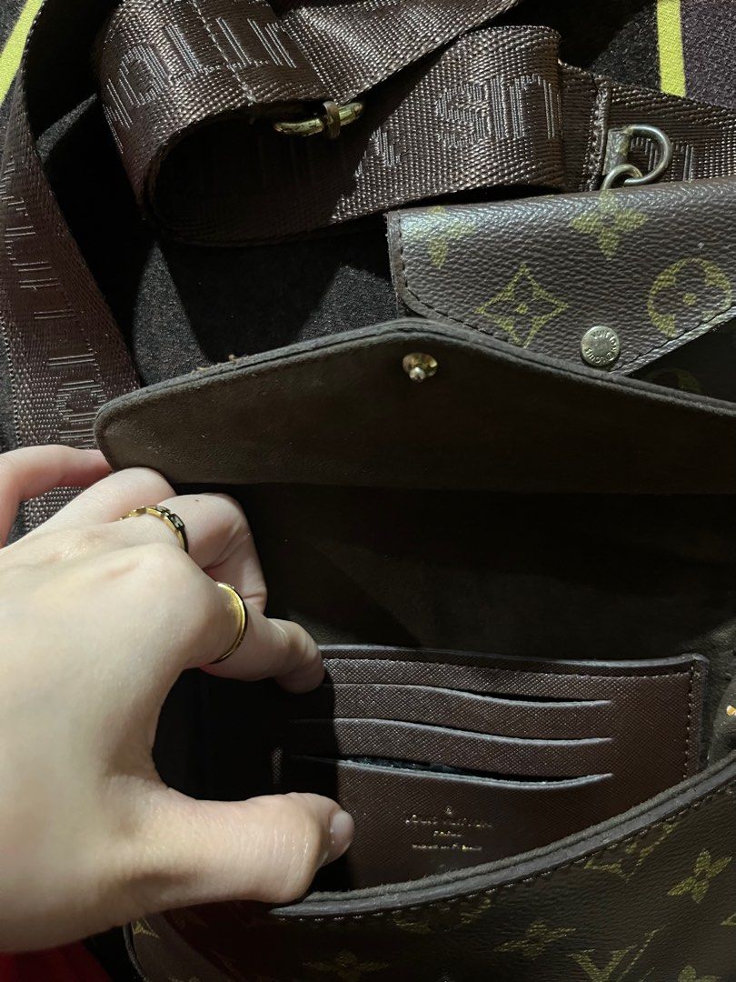 Louis Vuitton Slingbag Multi Pochette Accessoires (Category: Luxury Bags & Wallets) located in Pasay City. Submitted by l0vingrstore (Listing ID 1409401623, Image 3). Description: -Used not orignal - Authentic Louis Vuitton Multi Pochette Accessoires - Iconic monogram canvas - Adjustable strap included - Detachable coin purse included - Flap closure with snap button - Interior with card slots - Gold-toned hardware.