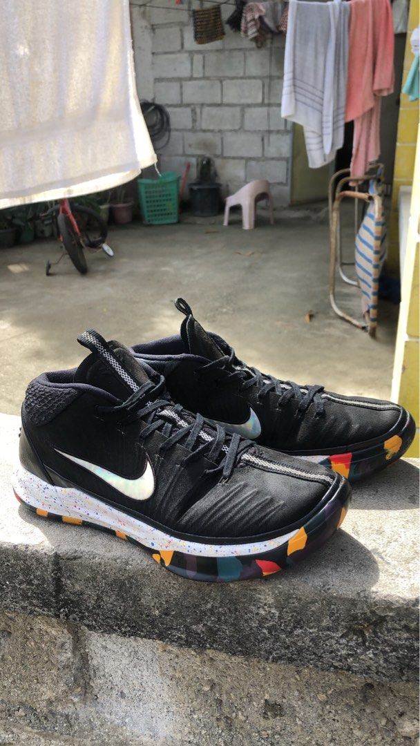 Nike Kobe Mid Ad “NCAA” (Category: Sneakers) located in Manila. Submitted by warmfalcon-b70c (Listing ID 1409319111, Image 1). Description: - Black Nike Kobe Mamba Focus basketball shoes - Black upper - White speckled midsole - Colorful outsole - Nike swoosh visible - High-top design with black laces - Kobe logo on heel - Soles show some wear - Shoes only no box.