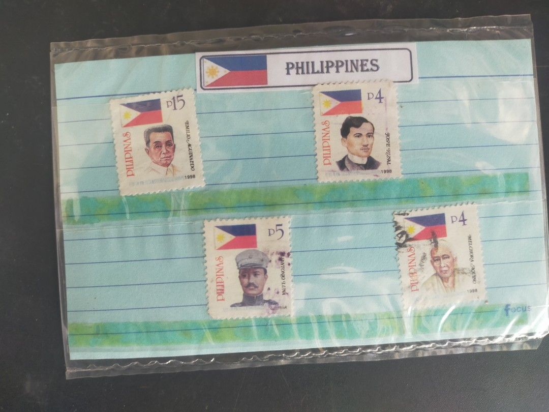 Philippine Stamps Set (Category: Stamps & Prints) located in Quezon City. Submitted by 88antiques (Listing ID 1409313961, Image 1). Description: - Set of Philippine stamps. - Features portraits of historical figures. - Includes P4 and P5 stamps. - Comes in a protective sleeve. - From the Philippines..