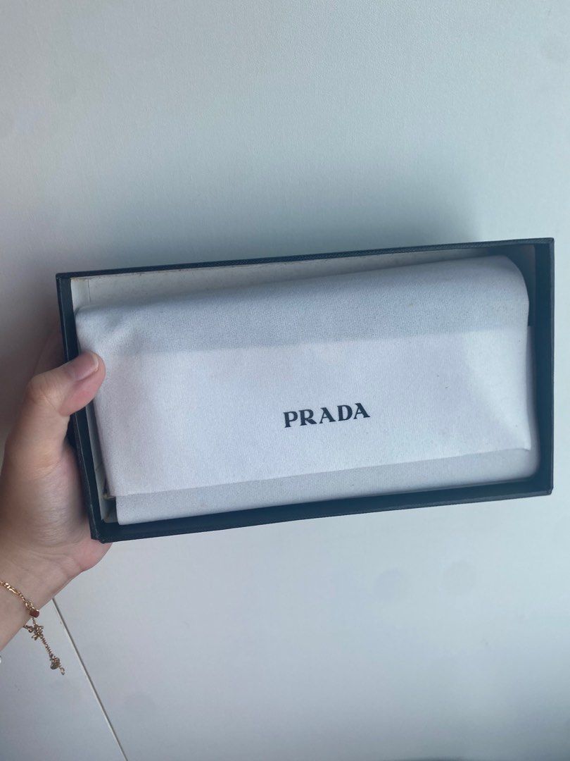 Prada Zip Around Wallet (Category: Luxury Bags & Wallets) located in Pasig City. Submitted by angelaaaj (Listing ID 1409313485, Image 3). Description: - Class A - Navy blue/Blue-green pebbled leather exterior - Gold-tone hardware - Includes original box and packaging - Zip closure - Prada logo detail.