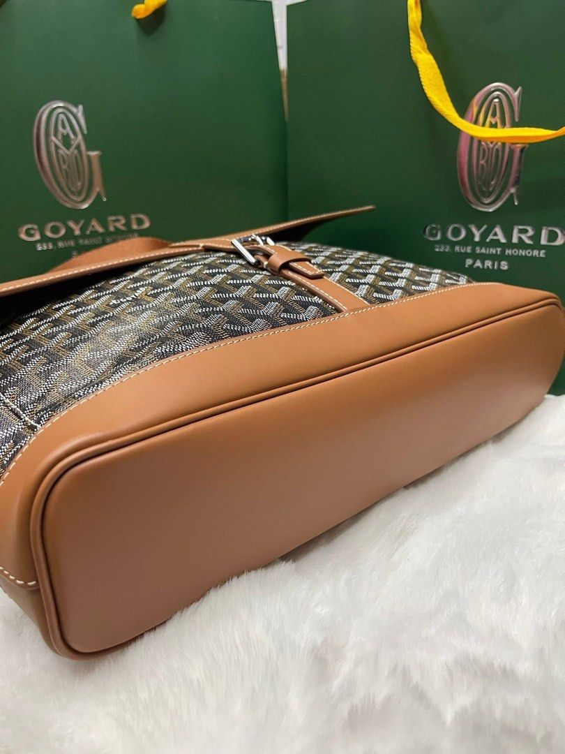 Preloved Saint-Sulpice Briefcase Bag (Category: Luxury Bags & Wallets) located in Manila. Submitted by bagsandshoesmanymore (Listing ID 1409310721, Image 3). Description: - Authentic Goyard Saint-Sulpice briefcase - Color: Brown and Black - Features: - Brown leather top flap, handle, and trim - Detachable shoulder strap - Quilted interior lining with pocket - Goyard logo visible - Includes dust bag.
