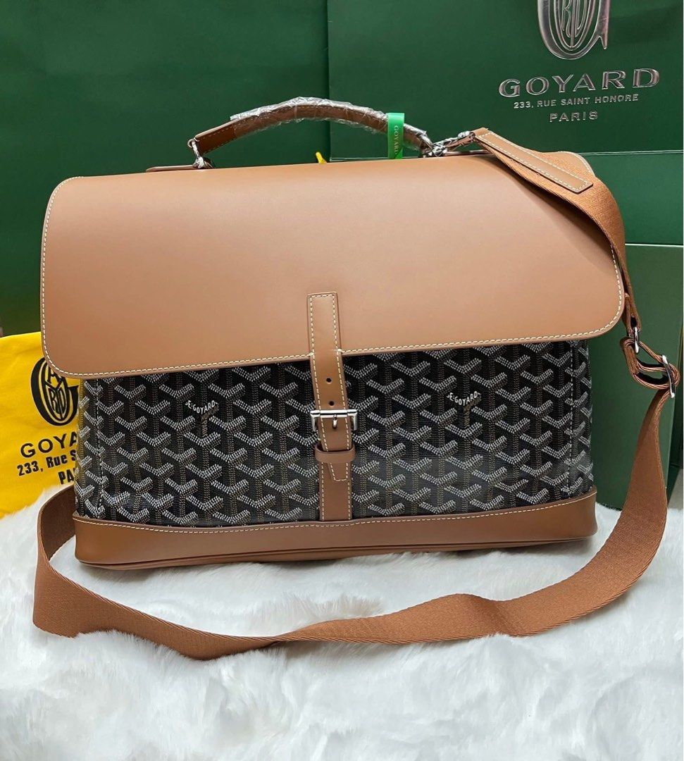 Preloved Saint-Sulpice Briefcase Bag (Category: Luxury Bags & Wallets) located in Manila. Submitted by bagsandshoesmanymore (Listing ID 1409310721, Image 1). Description: - Authentic Goyard Saint-Sulpice briefcase - Color: Brown and Black - Features: - Brown leather top flap, handle, and trim - Detachable shoulder strap - Quilted interior lining with pocket - Goyard logo visible - Includes dust bag.