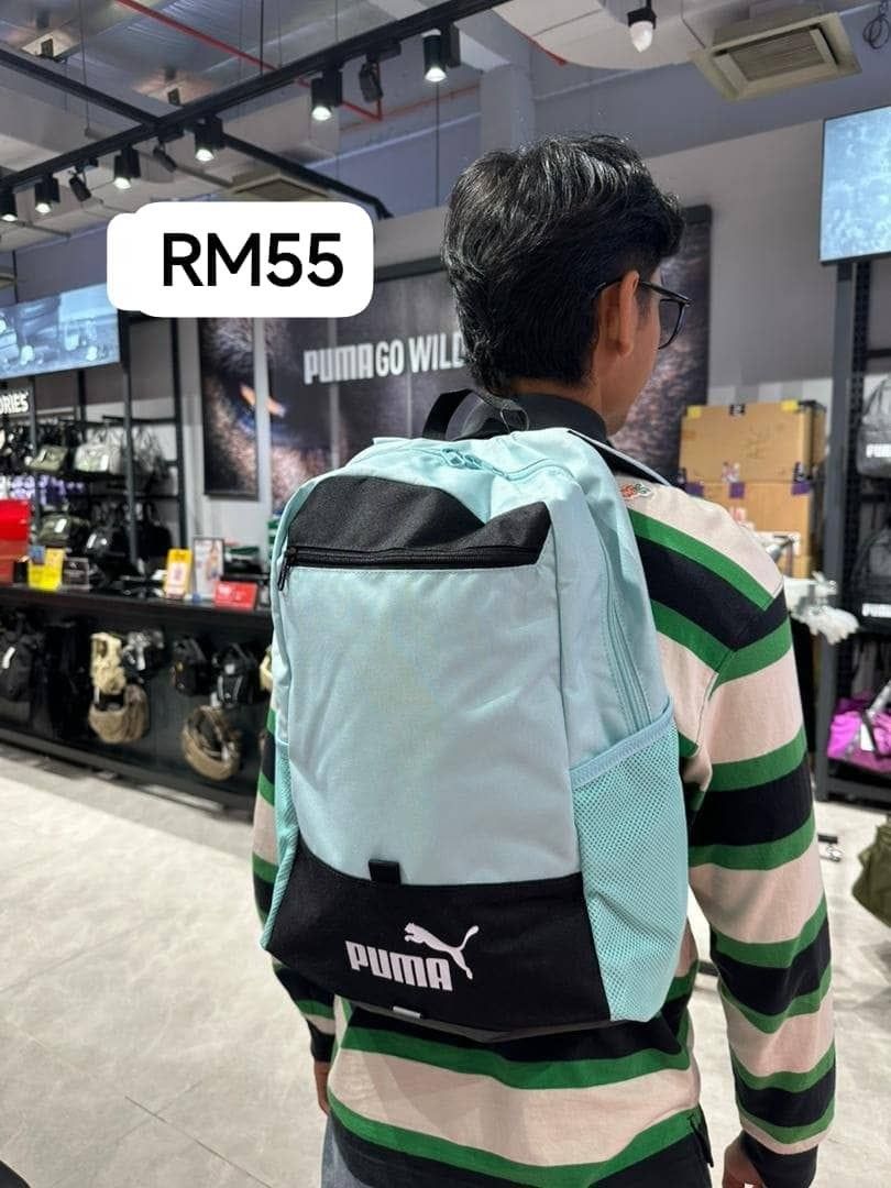 Puma Backpack (Category: Backpacks) located in Cyberjaya. Submitted by theeh (Listing ID 1409389367, Image 1). Description: - Puma backpack in light blue and black - Main compartment for storage - Front pocket for essentials - Side mesh pocket for water bottle - Puma logo on front - Suitable for everyday use and travel.