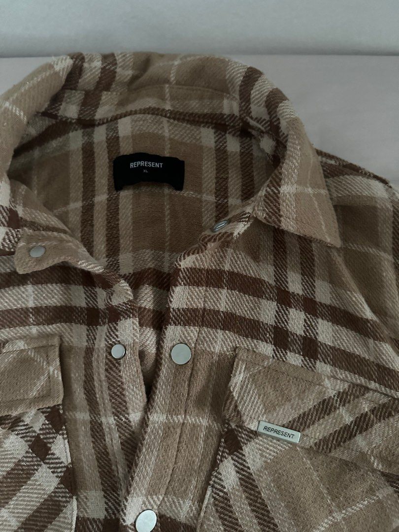 Represent flannel (Category: Tshirts & Polo Shirts) located in Singapore. Submitted by highlux888 (Listing ID 1409355213, Image 2). Description: - Represent flannel - Neutral colour palette - Size: XL - Button-up front - Two chest pockets - Represent logo (front and back) - Great for layering - NEVER WORN .