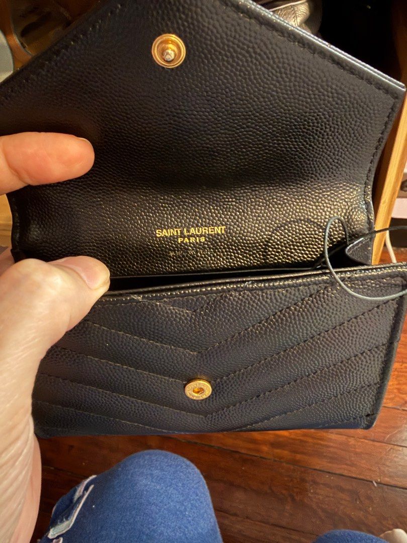 Saint Laurent Envelope Wallet/ card holder (Category: Luxury Bags & Wallets) located in Manila. Submitted by aralovezed (Listing ID 1409432080, Image 3). Description: - Authentic Saint Laurent Envelope Wallet/ card holder - Black color - Iconic YSL logo - Saint Laurent Paris interior marking - Includes original tags and packaging - Textured finish - Snap closure - tiny wear on stitch .