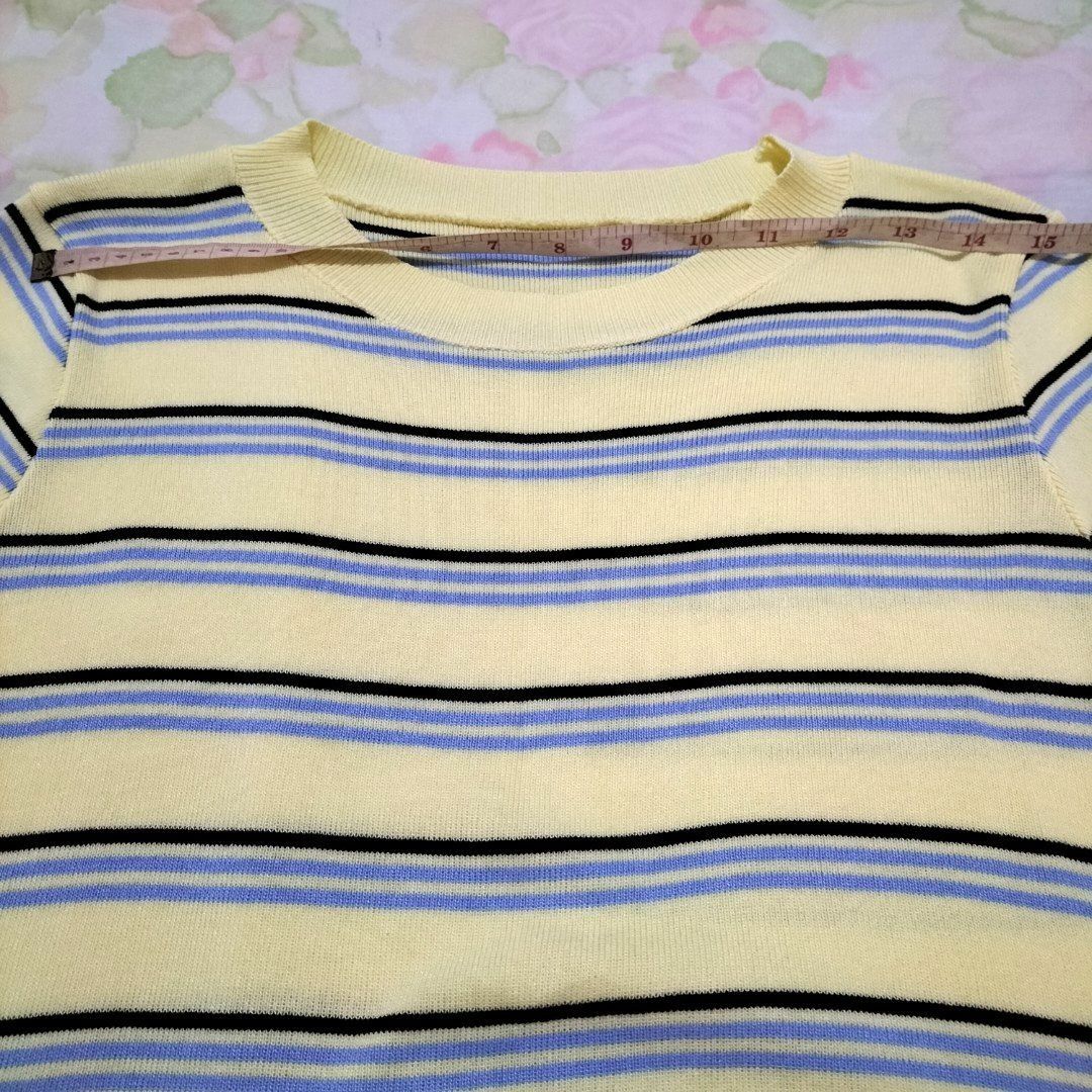 Striped Yellow Knit T-shirt (Category: Shirts) located in San Fernando. Submitted by decluttrwithella (Listing ID 1409329003, Image 3). Description: Size: S-M, measurements are shown in the photos (please allow 1-2 cm difference)📸 Color: Yellow with blue and black stripes (colors shown in photos may vary slightly due to lighting and different screens) Condition: No flaws!👌 PLS READ👇 - Payments thru Gcash - Shipping thru J&T - No when worn phot