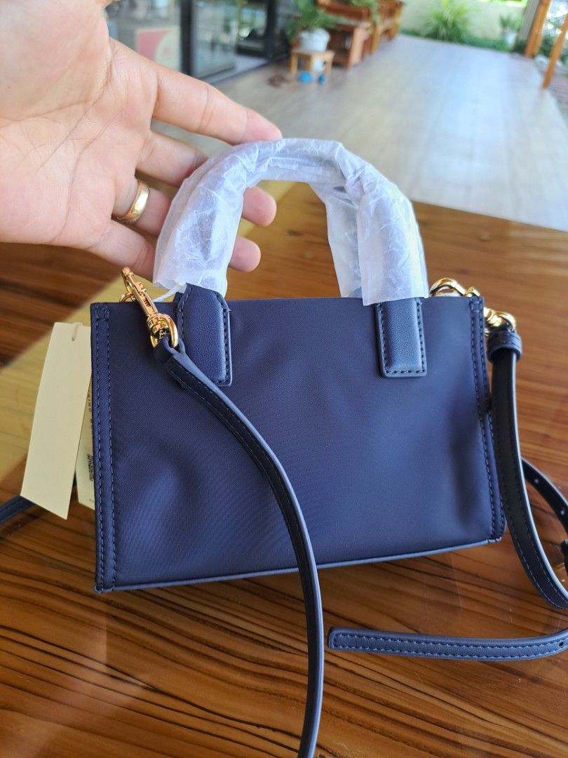 Tory Burch Navy Blue Mini Ella Tote Bag (Category: Luxury Bags & Wallets) located in Tagum. Submitted by luxestreetbags (Listing ID 1409275033, Image 3). Description: Super ganda 💖‼️ Authentic/Original Tory Burch Navy Blue Mini Ella Tote Sling/Crossbody Bag, Pabenta from US‼️‼️ Made in Cambodia With code Ideal zipper Inclusion: Price tag Brand new condition 😉 never pa nagamit. Legit online seller since 2016 with Physical Store‼️‼️ Location: San
