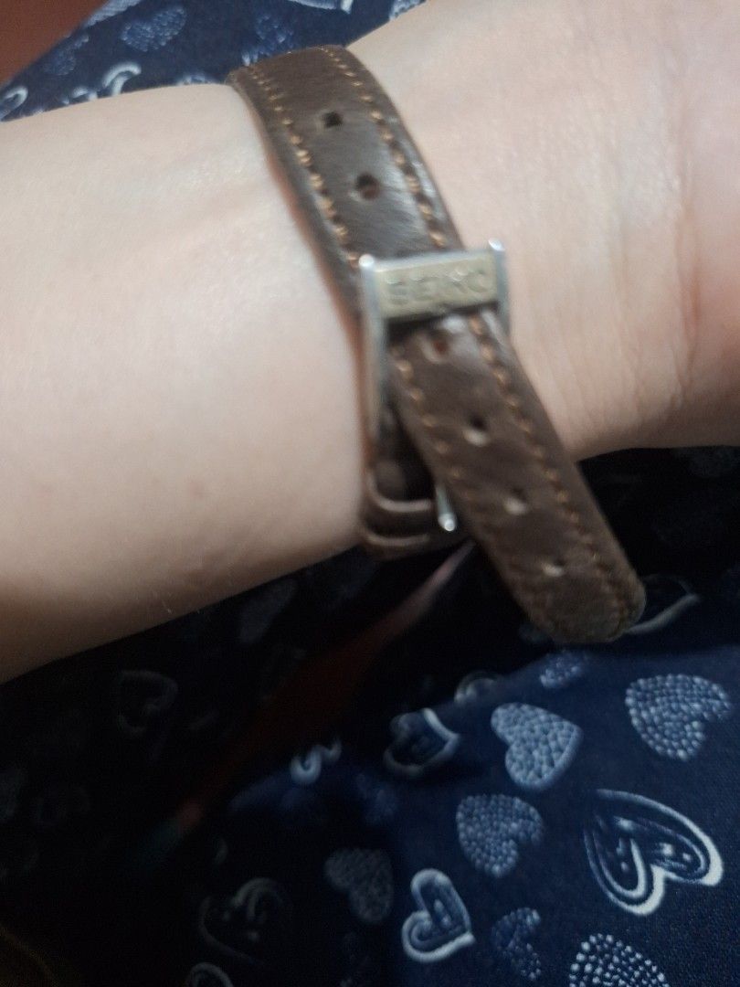 Vintage Watch with Brown Leather Strap (Category: Women's Watches) located in Manila. Submitted by elboh79270 (Listing ID 1409338777, Image 2). Description: - Vintage watch - Silver-colored face - Clear numerals and hands - Brown leather strap with buckle - In good working condition - Classic design.
