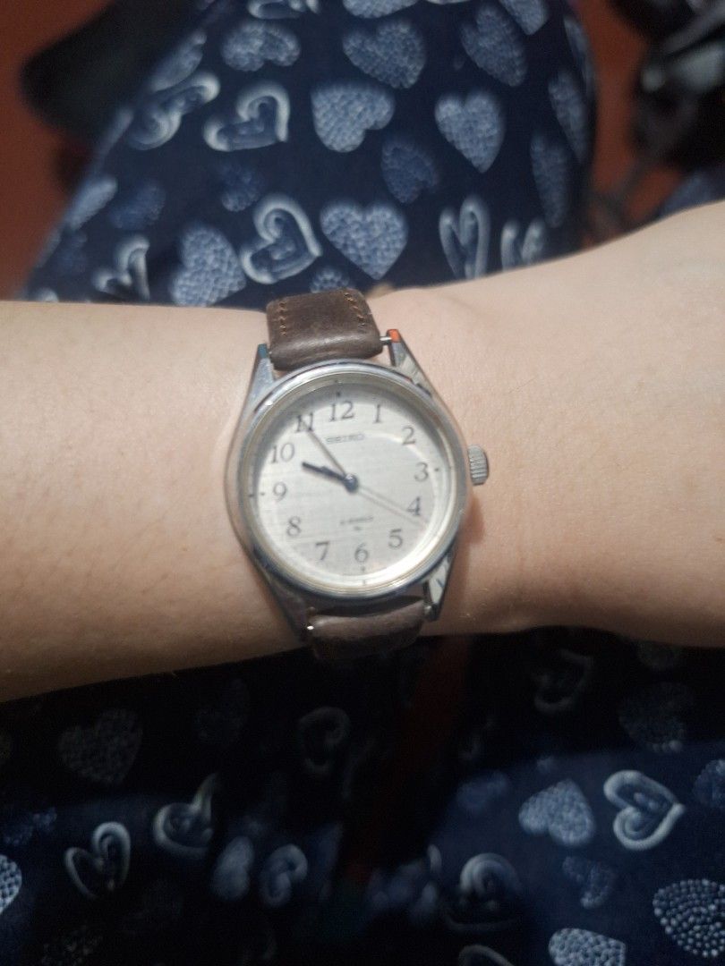 Vintage Watch with Brown Leather Strap (Category: Women's Watches) located in Manila. Submitted by elboh79270 (Listing ID 1409338777, Image 1). Description: - Vintage watch - Silver-colored face - Clear numerals and hands - Brown leather strap with buckle - In good working condition - Classic design.