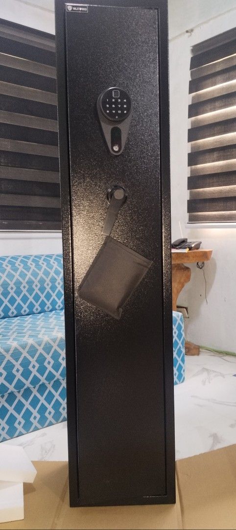 VLT Gun Safe with Digital Lock (Category: Safe) located in Caloocan City. Submitted by 5veezonlineshoppe (Listing ID 1409300183, Image 1). Description: Gun Vault Slim Type 30 x 28 x 138 cm L x W x H Hard metal alloy Wall mountable Brandnew With digital lock and fingerprint Comes with: Manual Keys Expansion battery Message for details We deliver #gunvault #gunsafe #gunsforriffle.