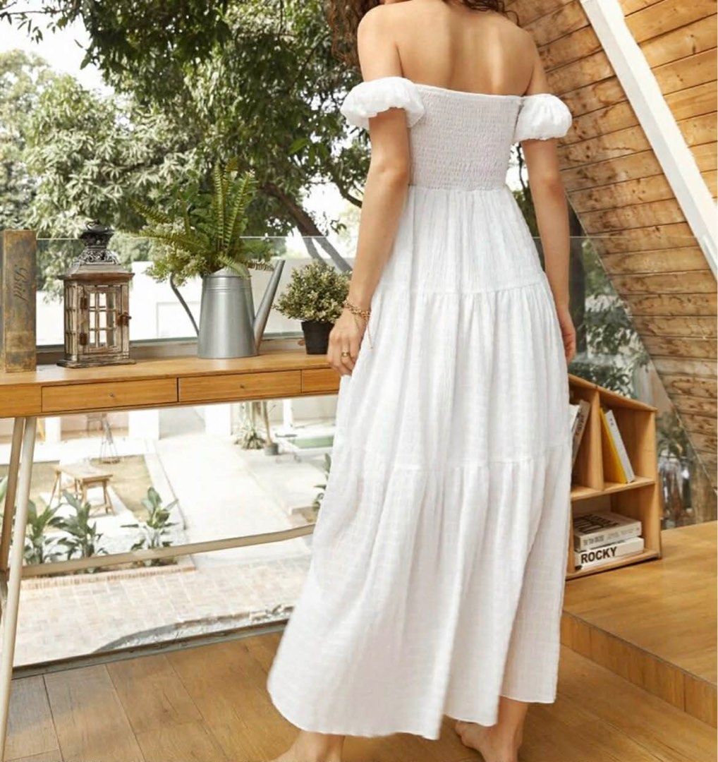 White Off-Shoulder Button Front Shirred Dress (Category: Dresses) located in Rizal. Submitted by preluvjay (Listing ID 1409401650, Image 2). Description: - Only used once. - Elegant white midi dress - Off-shoulder design - Ruffled sleeves - Fitted bodice - Flowy, tiered skirt - Textured fabric - Ideal for summer or special occasions.