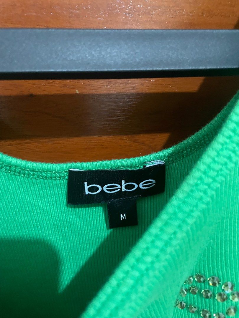 Y2K BEBE RHINESTONE GREEN RIBBED TANK TOP (Category: Sleeveless) located in Manila. Submitted by ms_hxppx (Listing ID 1409316865, Image 3). Description: - COLOR SHADE IS SLIGHTLY DIFFERENT IN PERSON DUE TO LIGHTING - SUPER CUTE - GOOD QUALITY - GOOD FITTING - DIDNT USE (SADLY THE COLOR DIDNT FIT FOR MY SKIN TONE)(IT WAS A GIFT FOR ME) .