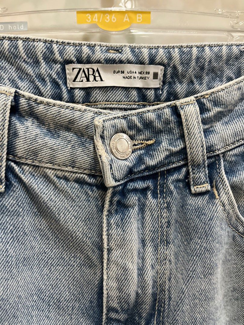 Zara Light Wash Straight Jeans (Category: Jeans) located in Manila. Submitted by jcmph (Listing ID 1409318263, Image 2). Description: Light wash Zara jeans. Features a straight leg fit with a raw hem. The jeans have a button and zipper closure. The label indicates a EUR size 36, USA size 4, and MEX size 26. Made in Turkey. Waist 27-28. High waist Length 41 inches .