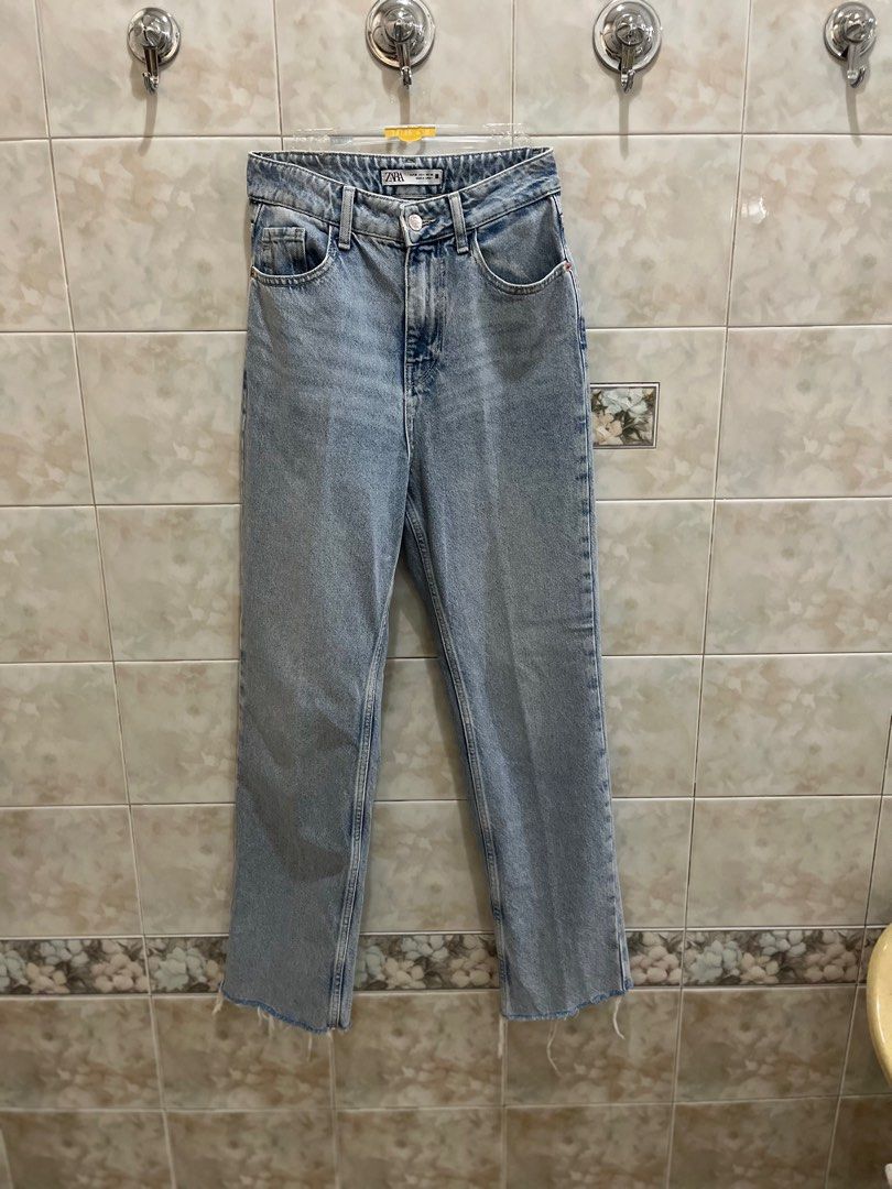 Zara Light Wash Straight Jeans (Category: Jeans) located in Manila. Submitted by jcmph (Listing ID 1409318263, Image 1). Description: Light wash Zara jeans. Features a straight leg fit with a raw hem. The jeans have a button and zipper closure. The label indicates a EUR size 36, USA size 4, and MEX size 26. Made in Turkey. Waist 27-28. High waist Length 41 inches .