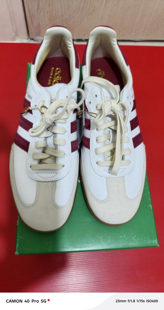 Adidas Samba x Sporty & Rich (Category: Sneakers) located in Pasig City. Submitted by rolandsells (Listing ID 1409470754, Image 3). Description: - Adidas Samba x Sporty & Rich collaboration - Classic white with maroon stripes - Features a cream-colored toe cap - Gum sole - Sporty & Rich logo detail - Comes with the original box - Box features Adidas and Sporty & Rich branding.