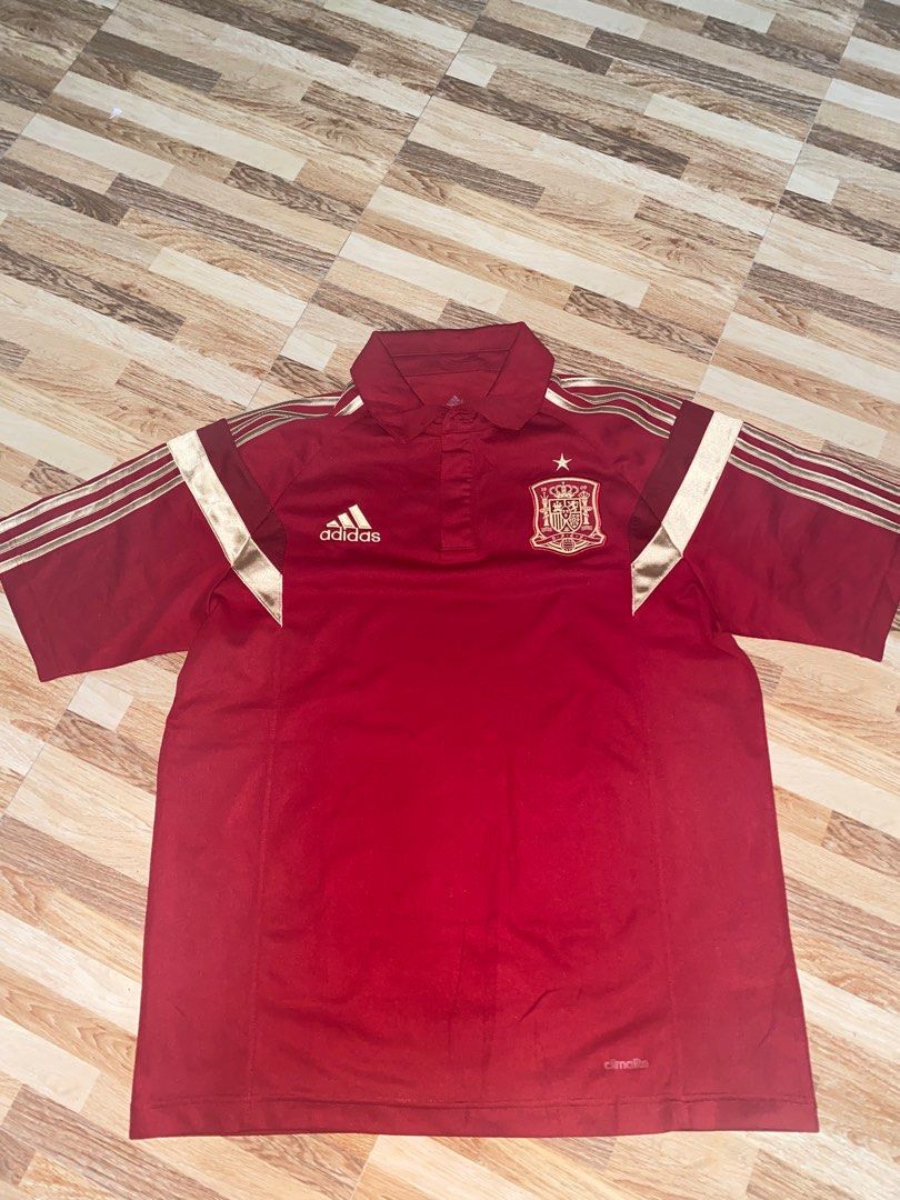 Adidas Spain National Team Jersey (Category: Activewear) located in Naga. Submitted by yspdl10 (Listing ID 1409457526, Image 1). Description: MINT CONDITION - Adidas Spain National Team jersey - Size: L - Color: Red with gold accents - Design: Polo collar, short sleeves - Features: Spain national team crest, Adidas logo - Technology: ClimaLite tag.