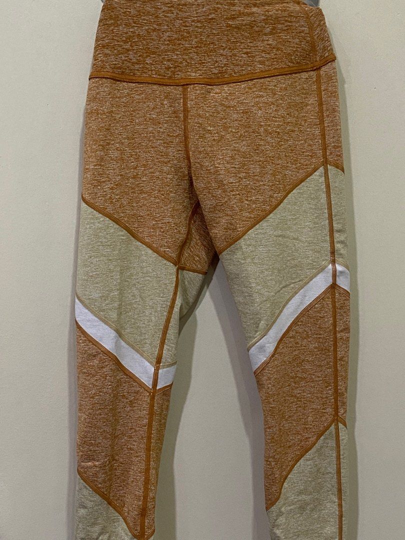 Alo Yoga High-Waist Leggings (Category: Activewear) located in Manila. Submitted by roseluxuryitems (Listing ID 1409496146, Image 3). Description: - Alo Yoga leggings - Unique color design - High-waist - Size S - Color: Tan, beige, and white - Features Alo logo - Made in vietnam - From us .