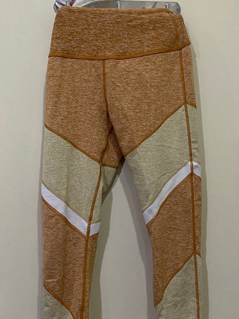 Alo Yoga High-Waist Leggings (Category: Activewear) located in Manila. Submitted by roseluxuryitems (Listing ID 1409496146, Image 1). Description: - Alo Yoga leggings - Unique color design - High-waist - Size S - Color: Tan, beige, and white - Features Alo logo - Made in vietnam - From us .