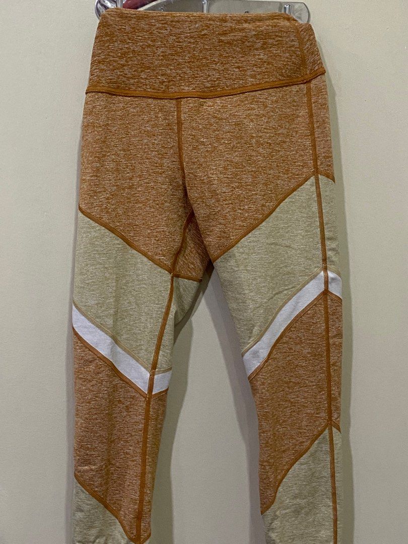 Alo Yoga High-Waist Leggings (Category: Activewear) located in Manila. Submitted by roseluxuryitems (Listing ID 1409496146, Image 2). Description: - Alo Yoga leggings - Unique color design - High-waist - Size S - Color: Tan, beige, and white - Features Alo logo - Made in vietnam - From us .