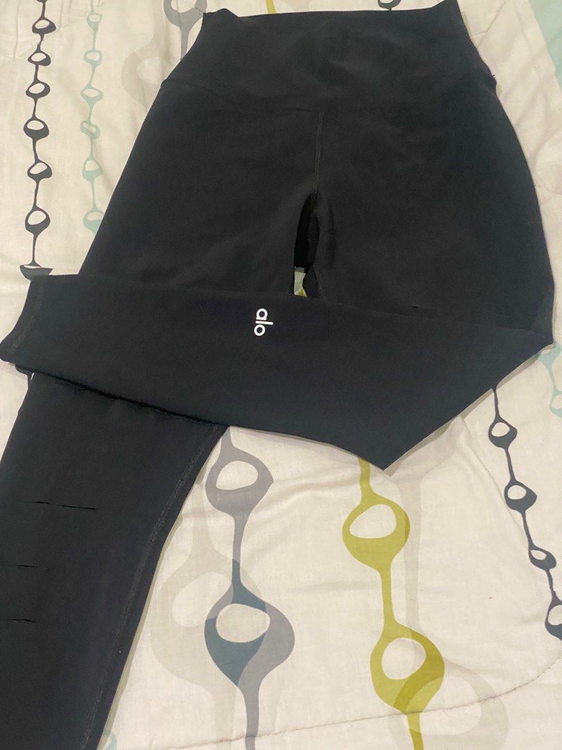 Alo Yoga Ripped Leggings - Black (Category: Activewear) located in Manila. Submitted by roseluxuryitems (Listing ID 1409505936, Image 1). Description: Black Alo Yoga leggings with ripped detailing . Made in Portugal. Features the Alo logo on the leg. Brand new condition From US .