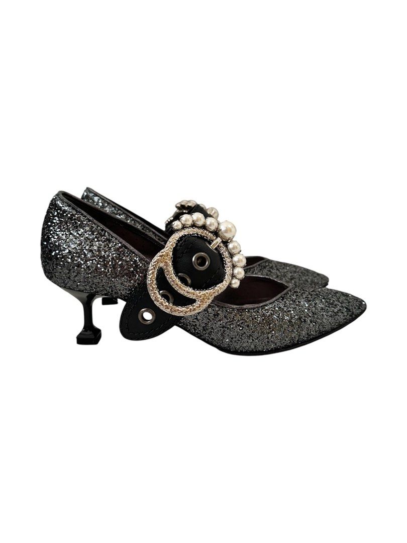 Authentic Miu Miu Glitter Mary Jane Heels (Category: Heels) located in Manila. Submitted by serendipitymanila (Listing ID 1409559131, Image 3). Description: - Miu Miu Mary Jane heels - Glitter finish - Pointed toe - Pearl embellished strap - Decorative buckle - Unique heel shape - Size 36 - Made in Italy.