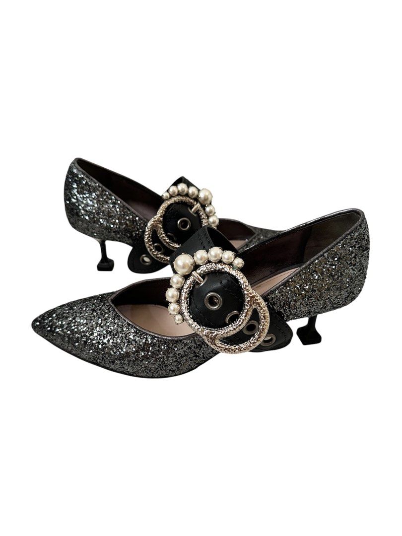 Authentic Miu Miu Glitter Mary Jane Heels (Category: Heels) located in Manila. Submitted by serendipitymanila (Listing ID 1409559131, Image 1). Description: - Miu Miu Mary Jane heels - Glitter finish - Pointed toe - Pearl embellished strap - Decorative buckle - Unique heel shape - Size 36 - Made in Italy.