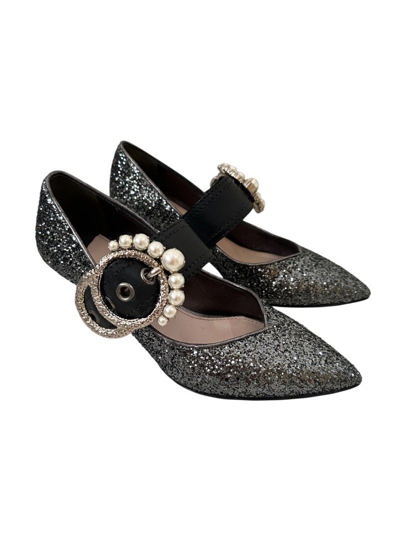 Authentic Miu Miu Glitter Mary Jane Heels (Category: Heels) located in Manila. Submitted by serendipitymanila (Listing ID 1409559131, Image 2). Description: - Miu Miu Mary Jane heels - Glitter finish - Pointed toe - Pearl embellished strap - Decorative buckle - Unique heel shape - Size 36 - Made in Italy.