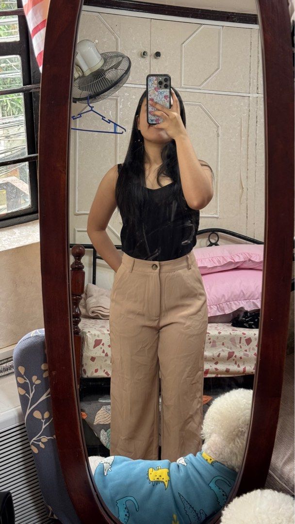 Beige Wide Leg Pants (Category: Other Bottoms) located in Quezon City. Submitted by declutterrringme (Listing ID 1409499328, Image 2). Description: - Beige wide-leg pants - High-waisted - Button closure - Relaxed fit - Lightweight fabric - Two front pockets - Versatile for various occasions.