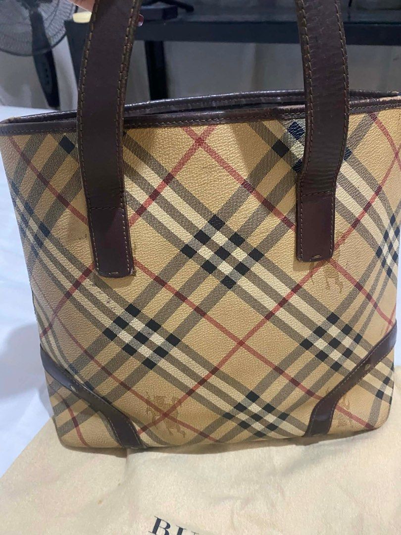 Burberry Checkered Tote Bag (Category: Luxury Bags & Wallets) located in Quezon City. Submitted by issasai (Listing ID 1409468390, Image 1). Description: - Authentic Burberry tote bag - Iconic checkered pattern - Brown leather handles and trim - Multiple interior compartments - Includes dust bag.