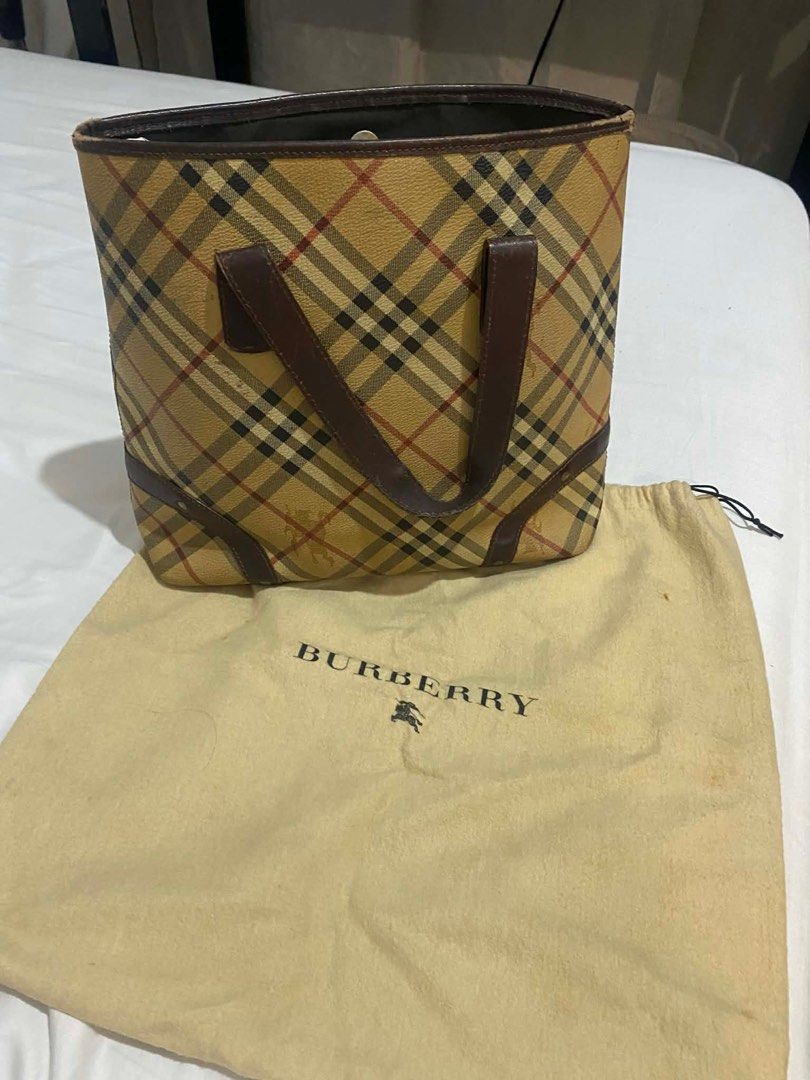 Burberry Checkered Tote Bag (Category: Luxury Bags & Wallets) located in Quezon City. Submitted by issasai (Listing ID 1409468390, Image 3). Description: - Authentic Burberry tote bag - Iconic checkered pattern - Brown leather handles and trim - Multiple interior compartments - Includes dust bag.