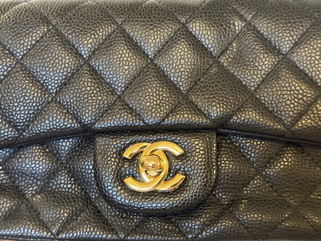 Chanel Classic Flap Bag Black Caviar Leather (Category: Luxury Bags & Wallets) located in Legazpi City. Submitted by shopwithstyleeee (Listing ID 1409557577, Image 2). Description: Chanel Classic Flap Bag in black caviar leather. Features the iconic CC turn-lock closure and a chain strap. The interior lining is a deep red color with the Chanel logo and "Made in France" embossed. The bag has a quilted design and gold-tone hardware..