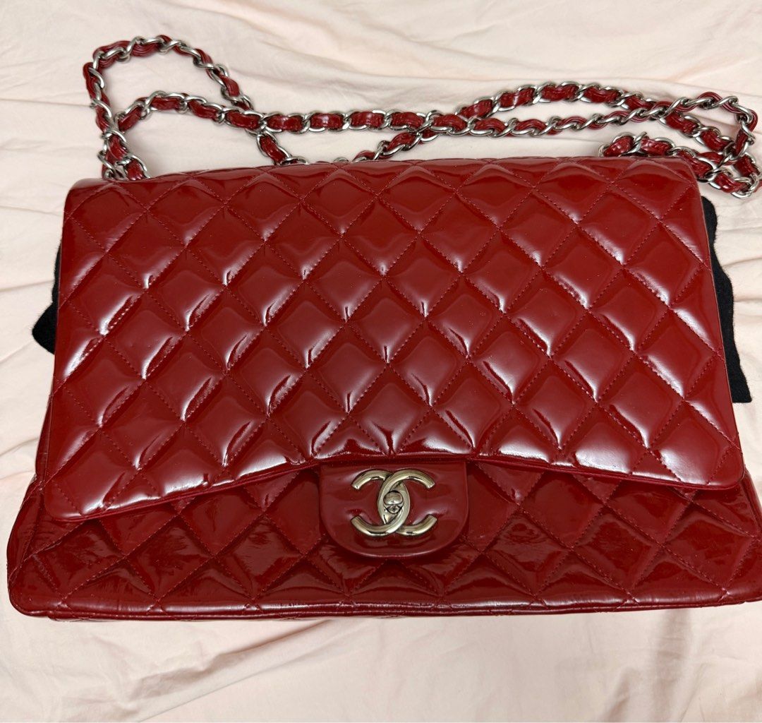 Chanel Red Patent jumbo double flap (Category: Luxury Bags & Wallets) located in Paranaque City. Submitted by patrickph31 (Listing ID 1409572103, Image 1). Description: - Authentic Chanel shoulder bag - Red patent leather - Classic quilted design - Silver chain strap - Red leather interior with Chanel logo - Includes authenticity card (serial number 14435848) - Made in France - Minor signs of wear.